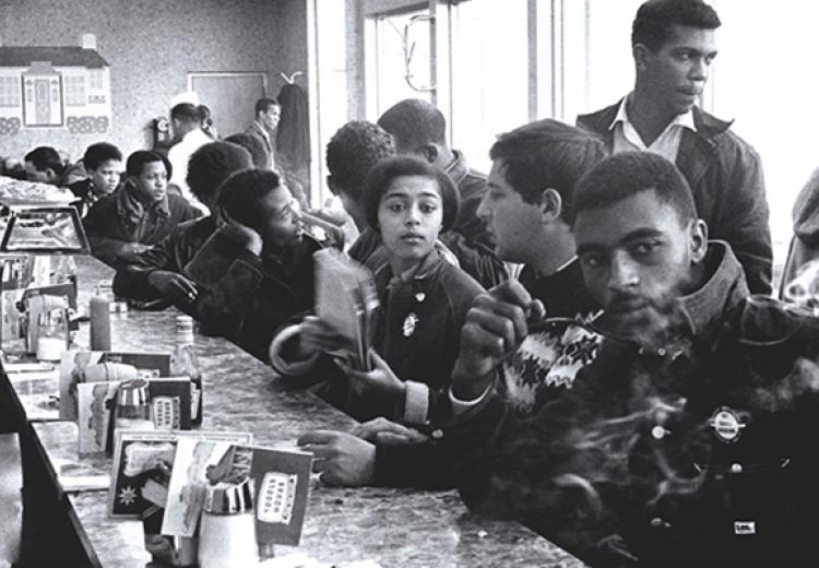 Judy Richardson (center, holding notebook) with other SNCC staff workers