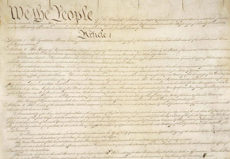 The first page of the United States Constitution, opening with the Preamble.