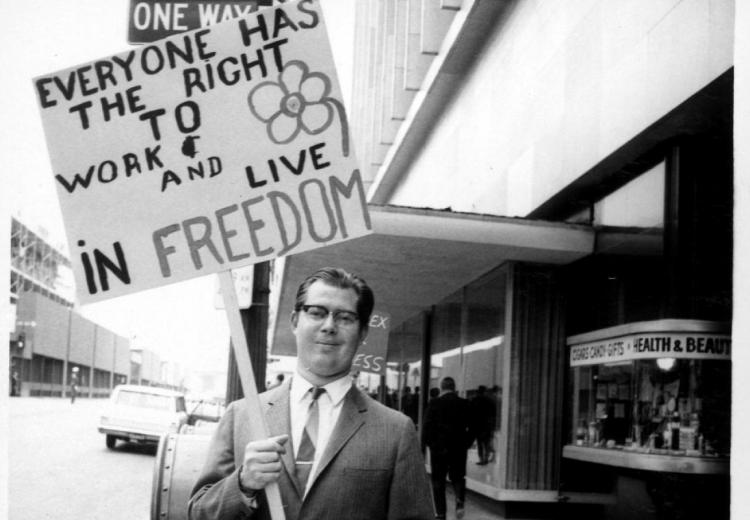 Demonstrator outside the State Steamship Lines, circa May 1969