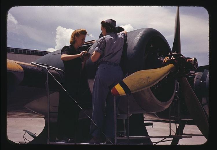 Bowen, a riveter, and Olsen, her supervisor, in the Assembly and Repair Dept. at the Naval Air Base in Corpus Christi, Texas (August, 1942).